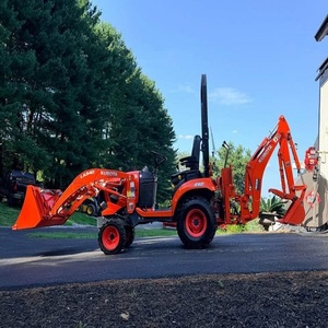 Potente tractor Kubota BX23S con sistema hidráulico de alta resistencia, cargador frontal, retroexcavadora y cómoda cabina de control para el operador. - Product Image 2
