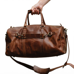 Durable <b>Leather</b> <b>Duffel</b> <b>Bag</b> for Travel Gym and Weekend Getaways with Spacious Interior Zipper Pockets Shoulder Strap - Product Image 1