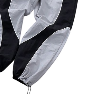 Conjunto de Pantalones y Chaqueta Deportiva de Nylon Impermeable con Capucha y Bloques de Color, Cortavientos de Otoño Personalizado OEM 2026 - Product Image 5