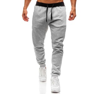 Pantalon de jogging gris pour homme, taille élastique avec cordon de serrage, poches latérales, coton mi-lourd respirant, idéal pour l'automne - Product Image 1