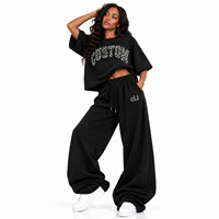Fournisseur de streetwear : Ensemble de survêtement noir avec tee-shirt court oversize à manches courtes et pantalon de survêtement à jambe large en molleton haute densité avec appliqué en tissu personnalisé