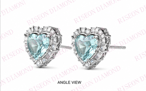 Elegant heart shaped blue diamond <b>stud</b> earrings with halo of round and baguette white diamonds in luxurious 18K white gold desig - Product Image 5