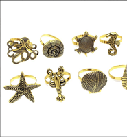 Anneaux et supports de serviettes en métal en forme d'étoile de mer, de conque, de hippocampe et d'abeille, écologiques, en stock pour les décorations de table de mariage et les hôtels