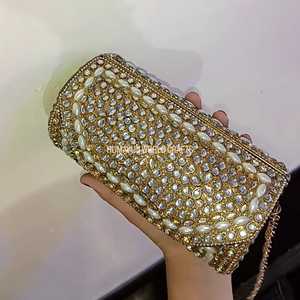Elegant <b>gold</b> kundan work <b>clutch</b> with pearls and crystals, handcrafted for weddings, parties, and festive occasions. - Product Image 3