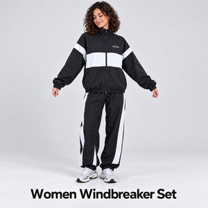 Conjunto Deportivo Cortavientos Blanco y Negro para Mujer, Chaqueta con Cierre y Paneles Diagonales, Pantalones con Puños, Diseño Nuevo Hecho a Medida, Conjunto de Dos Piezas - Product Image 4