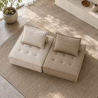 Canapé modulaire carré moderne en cuir véritable avec assise capitonnée et dossier rembourré en éponge, idéal pour appartement et hôtel