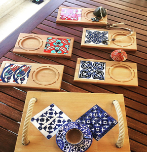 Set of 4 hanging <b>wood</b> <b>trivets</b> with vintage tile patterns. Available at wholesale prices. - Product Image 1