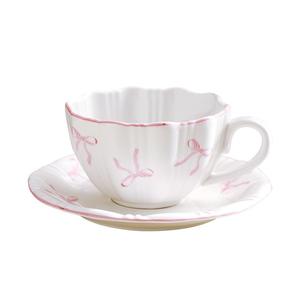 Encantadora taza de té de café de cerámica minimalista con adorable patrón de nudo de mariposa - Product Image 4