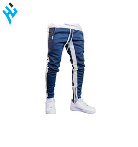 กางเกงวอร์มเข้ารูปสำหรับผู้ชายกางเกงผ้าฝ้ายแบบมีซิปสำหรับออกกำลังกายฟิตเนสแบบกำหนดเอง - Product Image 1