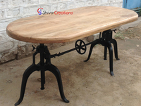 Table à manger ovale vintage industrielle faite à la main avec plateau en bois de manguier et base en fonte réglable en hauteur, écologique, pour hôtel