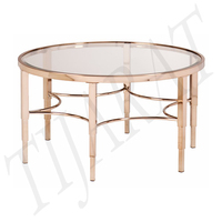 Table à manger moderne en métal et verre avec finition polie, structure en acier inoxydable pour salon et décoration intérieure