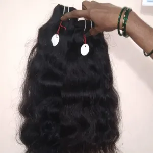 Sciolti ondulati capelli umani di estensione. Tempio grezzo tessitura dei capelli da india