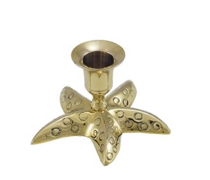 Portavelas de latón con forma de estrella - Product Image 1
