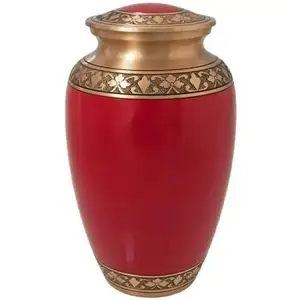 The Cherry Red Cremation Urn is made of solid brass. It is painted a beautiful shade of red with brass bands wrapping around