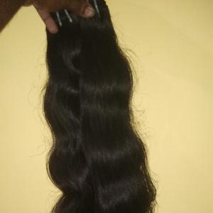 Cabello humano natural virgen indio con textura ondulada sin procesar - Product Image 1