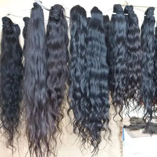 Raw virgin Indian wavy black Virgin human hair extensions 12A Indian manufacturer in India