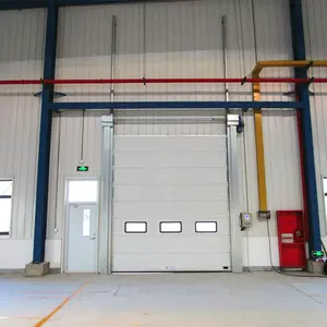 Porte de garage industrielle sectionnelle automatique avec porte piétonne