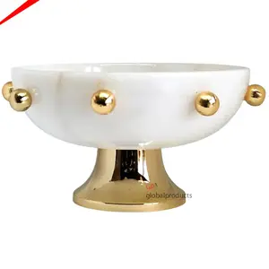 white marble and golden metal round serving bowl with decorative golden balls for home hotel wedding decor food serving bowl