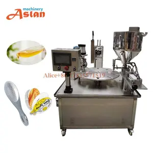 rotary honey spoon filling film sealing machine/plastic spoon paste filling Aluminum foil film packing machine