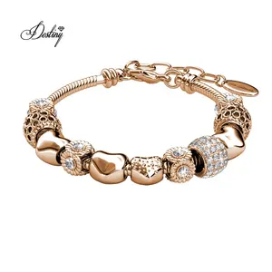 Bracelet pour femmes Daisini plaqué or 18 carats avec charmes en forme de cœur d'amour rayonnants, réglable, orné de cristaux Swarovski - Product Image 1