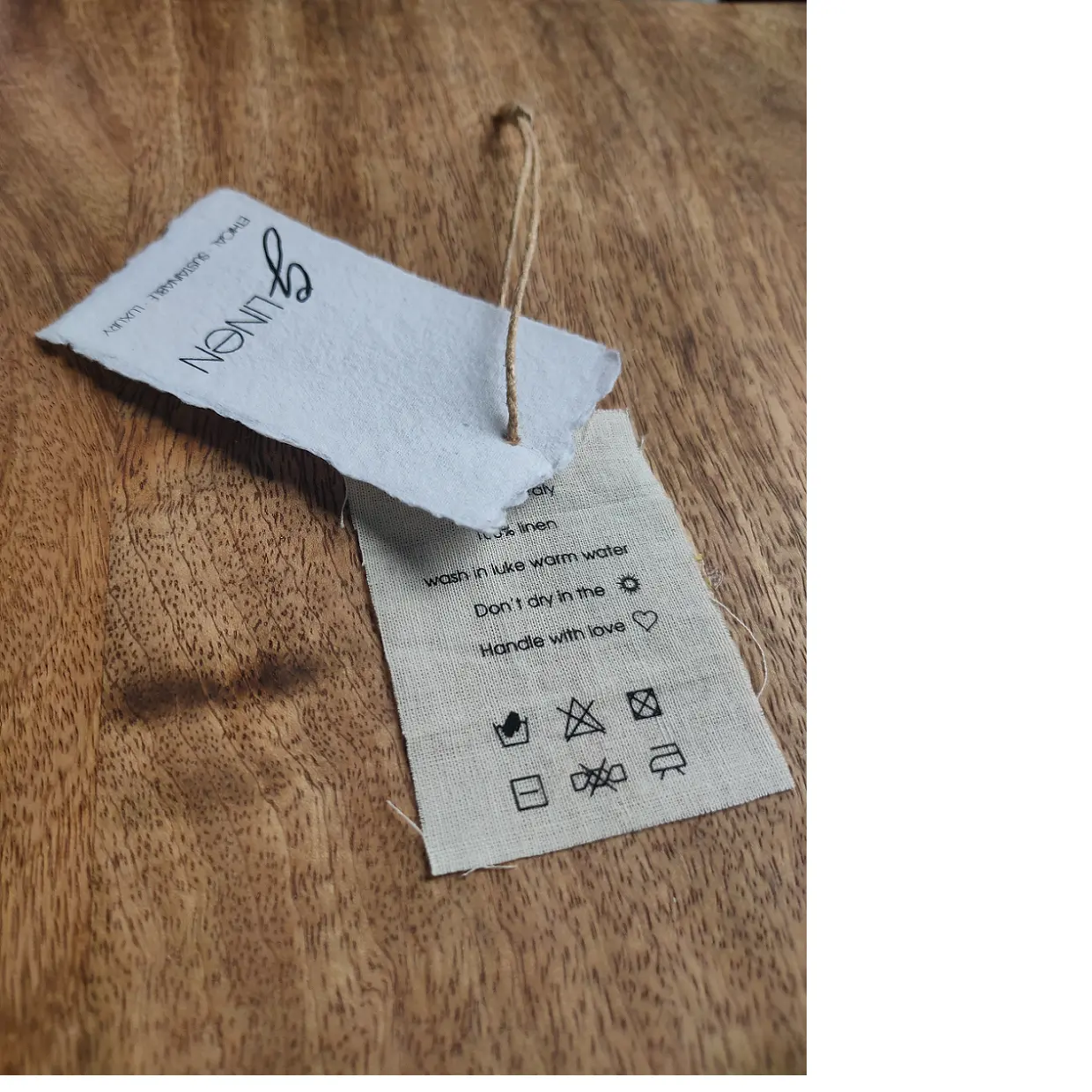 deckle edged printed hang tags with cotton fabric inserts, suitable for clothing designers and manufacturers