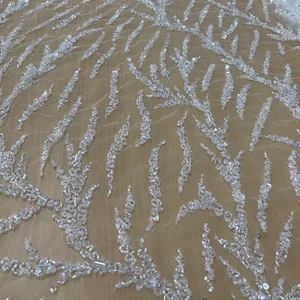 2023 nueva moda vestido de novia tela de encaje blanco con cuentas pesadas con lentejuelas de cristal hecho a mano de lujo de nailon venta rápida - Product Image 1