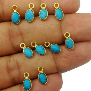 Colgante con forma pequeña ovalada turquesa, 4x6mm, oro, bisel Vermeil - Product Image 1