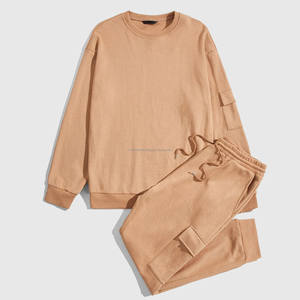 Combinaison à col rond unie avec poche sur la manche, style patch, tissu léger et écologique, survêtement de printemps, pantalon de survêtement unisexe - Product Image 1