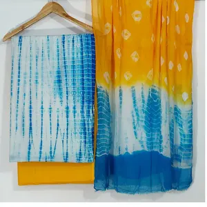 Tessuti in cotone stampato tie and dye in bellissime tonalità di giallo e blu adatti per l'uso in tessuti per la casa e per l'abbigliamento ma