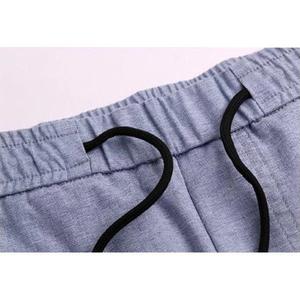 กางเกงขาสั้นลำลองผู้ชายฤดูร้อนสีทึบเอวยางยืดมีเชือกรูดขนาดพิเศษระบายอากาศป้องกันการเกิดรอยยับวัสดุถักที่เป็นมิตรกับสิ่งแวดล้อม - Product Image 3