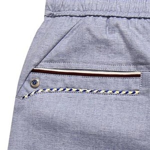 กางเกงขาสั้นลำลองผู้ชายฤดูร้อนสีทึบเอวยางยืดมีเชือกรูดขนาดพิเศษระบายอากาศป้องกันการเกิดรอยยับวัสดุถักที่เป็นมิตรกับสิ่งแวดล้อม - Product Image 4