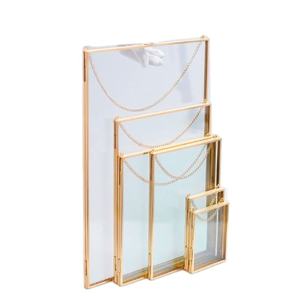 Ensemble de 6 cadres photo suspendus muraux en métal doré avec finition en verre brillant, parfaits pour la décoration de la chambre à coucher et l'affichage élégant - Product Image 1