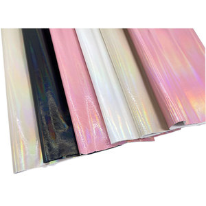 Tissu en cuir synthétique artificiel brillant iridescent effet arc-en-ciel en PVC/PU, <span class=keywords><strong>prix</strong></span> au mètre, pour la fabrication <span class=keywords><strong>de</strong></span> sacs à main, sacs et portefeuilles - Product Image 1
