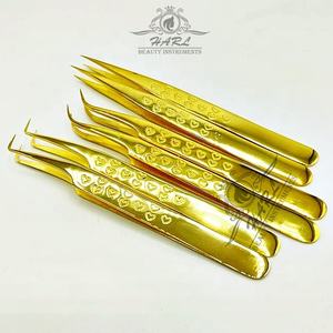 Pinzas para pestañas y cejas con agarre curvo de 90 grados personalizables Diseño de corazón chapado en oro Acero inoxidable para uso de volumen - Product Image 2