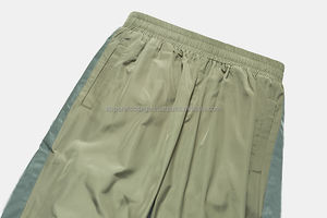 Rue de haute qualité mode hommes vêtements de sport poches latérales bandes réfléchissantes polyester lâche style conique en nylon vent pantalon de survêtement - Product Image 5