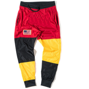 Pantalones de chándal cortavientos de nailon ligeros para hombre, ropa deportiva de bloque de Color informal de moda, impermeable recto - Product Image 1