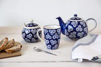 Théière en céramique bleu marine avec infuseur, motif petites marguerites, globe bleu en grès