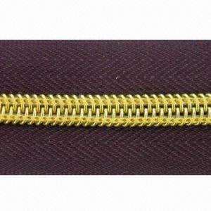 Cremallera de nailon con dientes dorados, resistente - Product Image 2