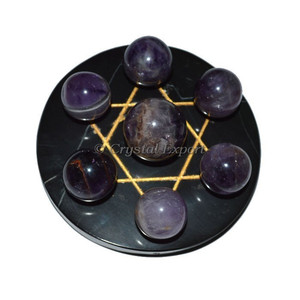 Étoile de David dorée avec boule de chakra en améthyste sur agate noire - Product Image 1