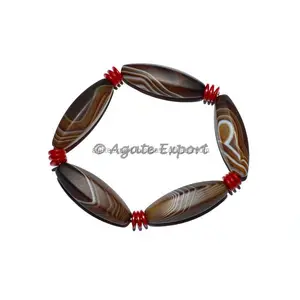 Brazaletes facetados de ágata con bandas marrón-Feng Shui y estilo bohemio hechos a mano Unisex arte y regalo coleccionable - Product Image 1