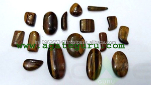 พลอยธรรมชาติทรงหลังเบี้ยตาเสือผสมรูปร่างและขนาด - Product Image 1