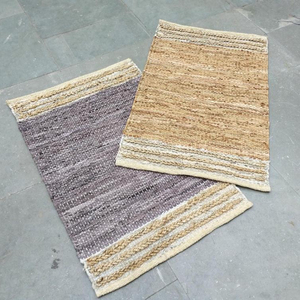 Alfombra trenzada lavable de cuero de vaca natural y yute - Product Image 1