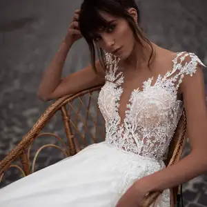 Elegante sexy di tulle del pannello esterno senza maniche illusion top appliques torna corte dei treni beach creamlace abiti da sposa una linea di abiti da sposa