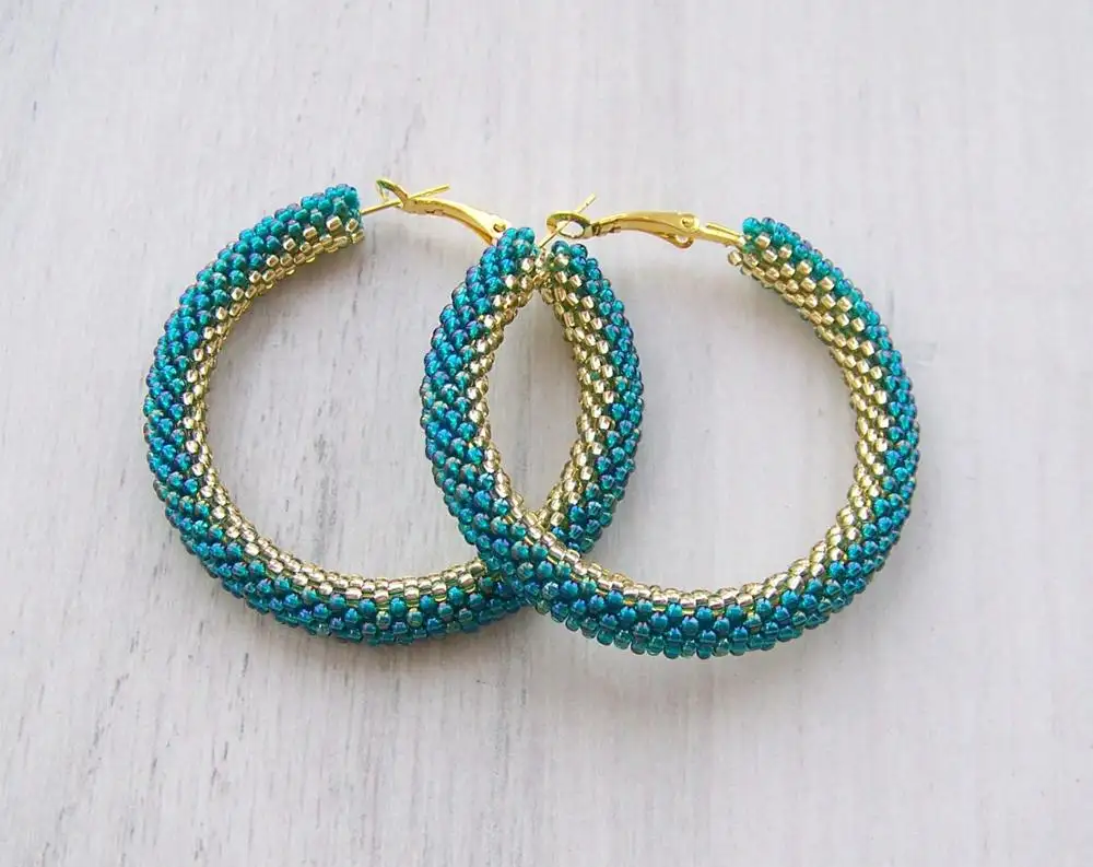 Beaded hoop earrings in Iridescent Teal and Gold - Snake bead crochet earrings