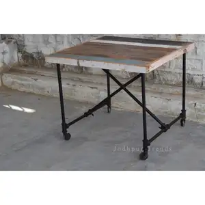 vintage restored folding Dining table supplier / industrial iron and reclaimed wooden furniture With Wheels