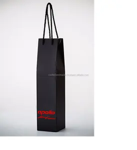 handmade paper wine bottle bags with satin ribbon handles and with polka dot flock print suitable for wine manufacturer