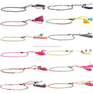   Bracelet artisanal en perles de millet, bijoux mixtes, pompon, breloque multicolore, fait main - Product Image 1