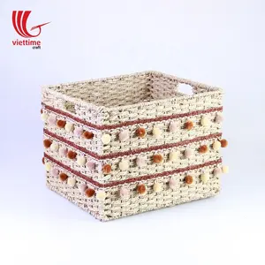 Panier en jonc de mer bon marché tissé à la main avec des mini glands pour le stockage de vêtements - Product Image 1