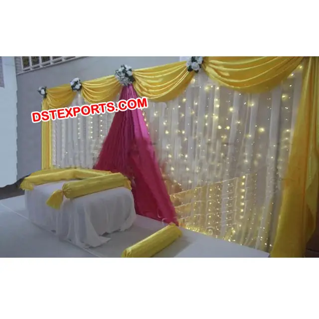 Mehandiステージ背景セット結婚式のステージ装飾のアイデア黄色と白の壁のカーテン背景パーティーの装飾