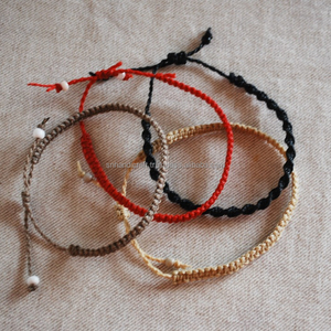 Surfer <b>Bracelet</b> <b>Set</b> / 4 Macrame <b>Bracelets</b> / Black Gray Yellow and Red / Stack able Tiny <b>Bracelets</b> / Surf <b>Bracelets</b> - Product Image 1